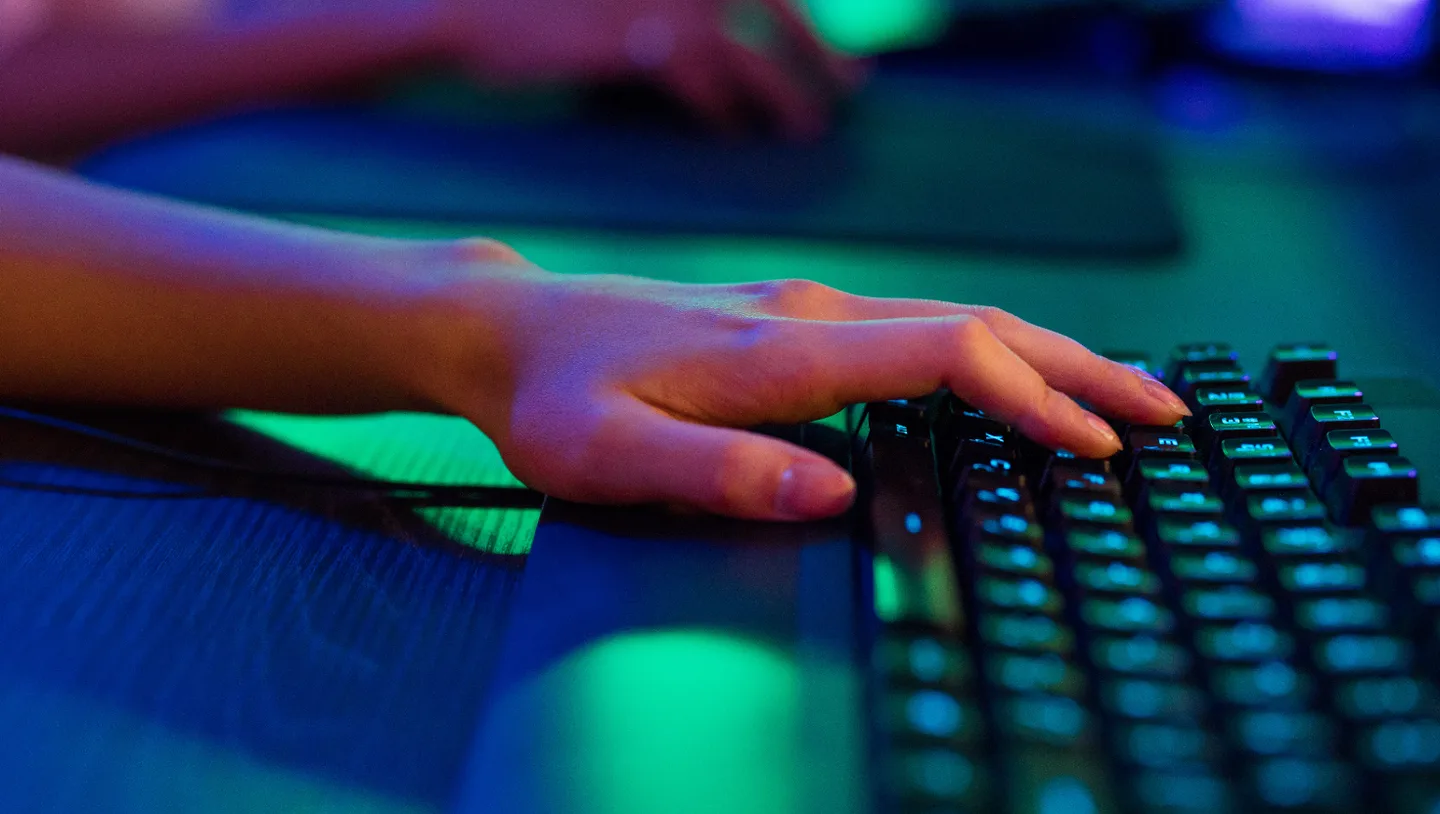 Hands at a colorful keyboard